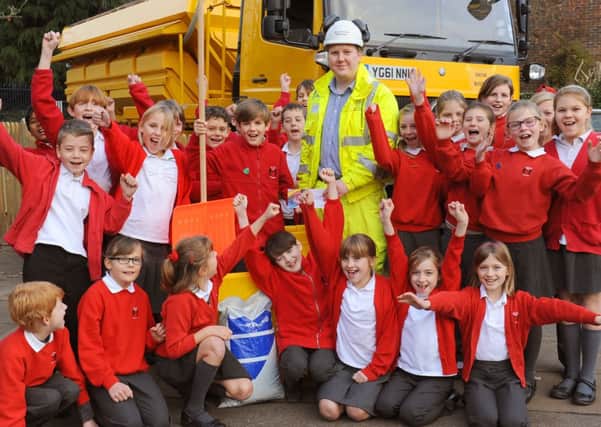JPCT 041213 William Penn school, Coolham. Gritter competition winner, Jack Osborne (centre holding shovel) 10 receives his prize from Ed Baldwin, (commumity liason manager). Photo by Derek Martin