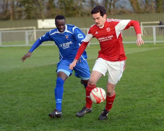 Ade Olorunda, pictured here closing down an Arundel opponent last weekend, is likely to start for Rye United against East Preston tomorrow. Picture by Liz Pearce