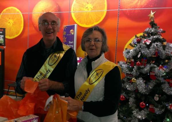 Rosemary and Ted Benwell from Crawley Easter team helping shoppers in Sainsbury's