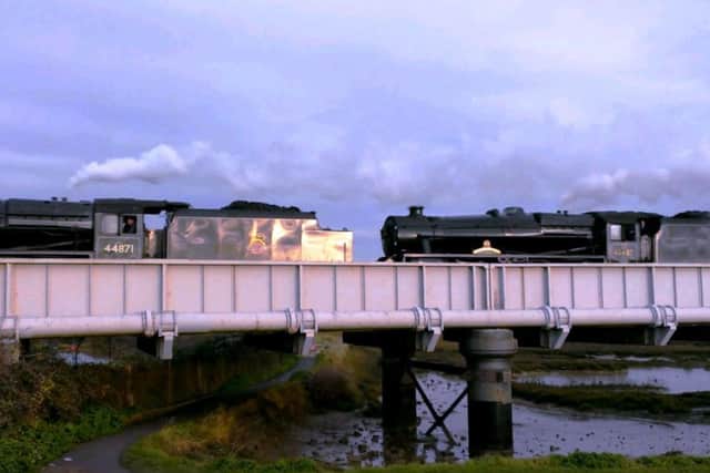 Not one, but two steam locomotives pass over the railway bridge across the River Adur at Shoreham
