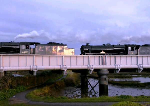 Not one, but two steam locomotives pass over the railway bridge across the River Adur at Shoreham