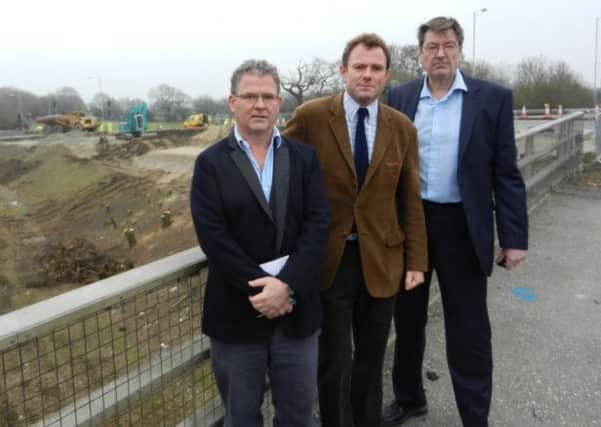 James Stewart, left, with Nick Herbert MP and Paul Dendle outside the Crossbush road works