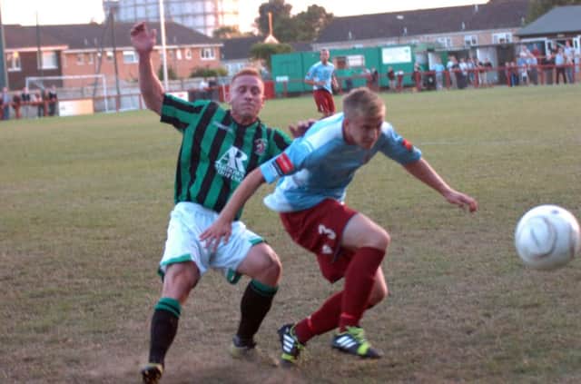 Andy Corrigan in the thick of the action for Hastings United away to Burgess Hill Town in August. Picture by Simon Newstead