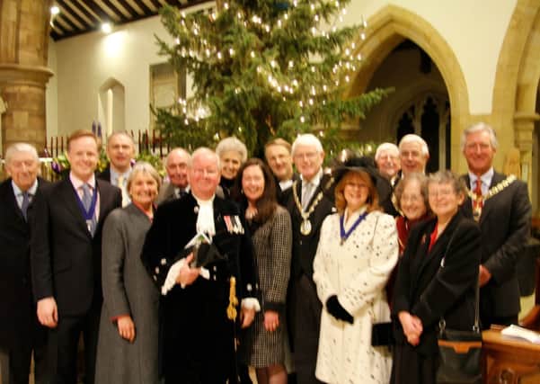 Some of the guests at the Horsham District Community Christmas Carol Service with the Chairman of HDC Philip Circus and his wife Gaenor.