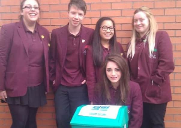 Some of the community captains pictured with the recycling bin