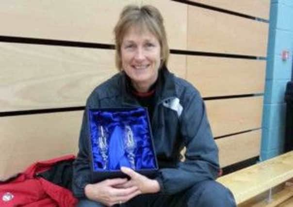 Cathy Bargh with her prize for winning the over-50 women's singles at the English National Masters Badminton Championships 2013