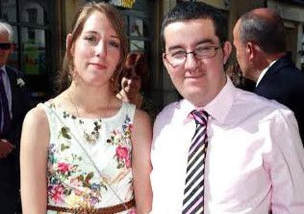 Police have launched a murder investigation following the death of Terry Davies, right, who was killed when his flat burnt down. Mr Davies is pictured with his girlfriend Kerry Stark, 19.