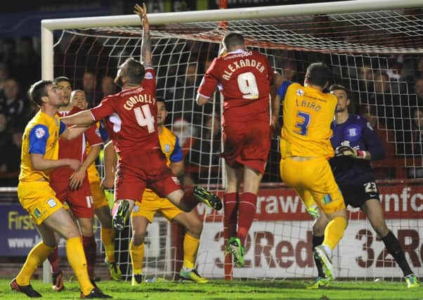 Gary Alexander heads in Crawley Town's 90th minute equaliser in their 2-2 draw with Preston North End at the Checkatrade.com Stadium
