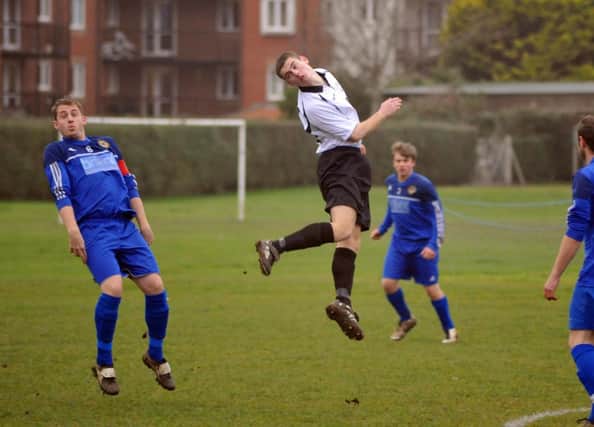 Action from Bexhill United's 3-0 win at home to Rustington on Saturday. Picture by Steve Hunnisett (eh51019e)