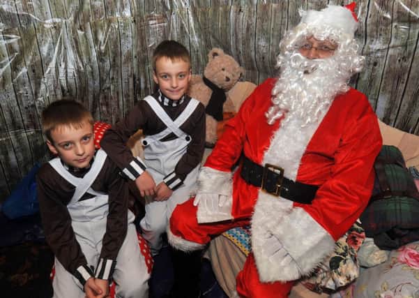 13/12/13- Christmas fair at St Michaels School, Playden.  Jake and Liam Etches with Santa (John Wentworth-Foster).