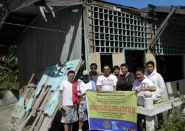 The Littlehampton Rotary Club has donated £3,000 to help the disaster relief work in the Phillipines. Pictured is a local rotary group in the Phillipines.