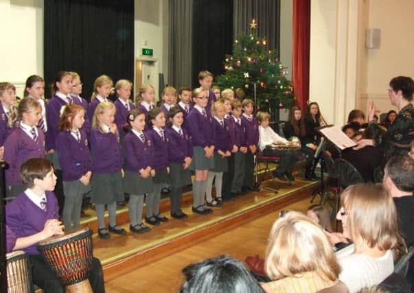 The choir from St Cuthbert Mayne School singing at the Rotary Club of Cranleighs Annual Carol Concert