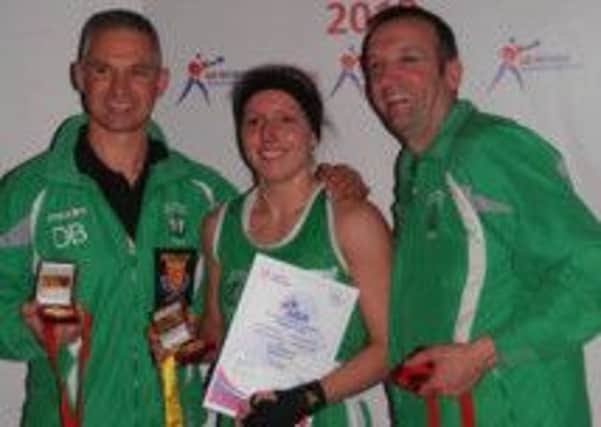 Belinda Skinner (centre) with West Hill ABC coaches Dave Bishop (left) and Gary White