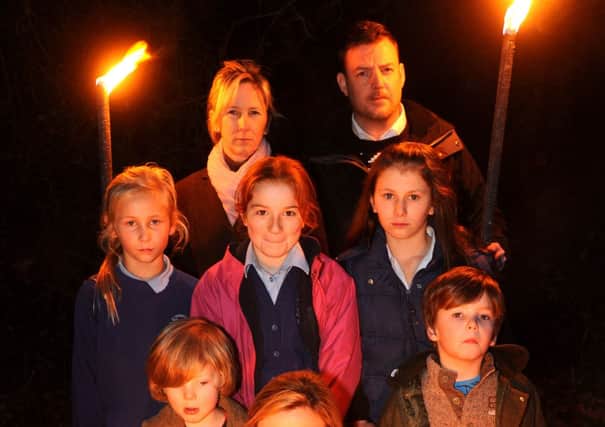 Wineham children hold torchlit demonstration against the planned new town. Pic Steve Robards