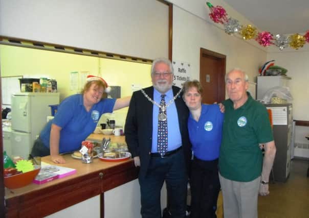 Adur Council chairman Mike Mendoza with volunteers at the Southlanders Community CafÃ© in Shoreham