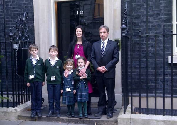 Pupils Gerald Schilthuis-Duggan, James Beard, Molly Cass and Lara Leppenwell with Emily Leppenwell and Crawley MP Henry Smith handing in a petition to the Prime Minister before Christmas