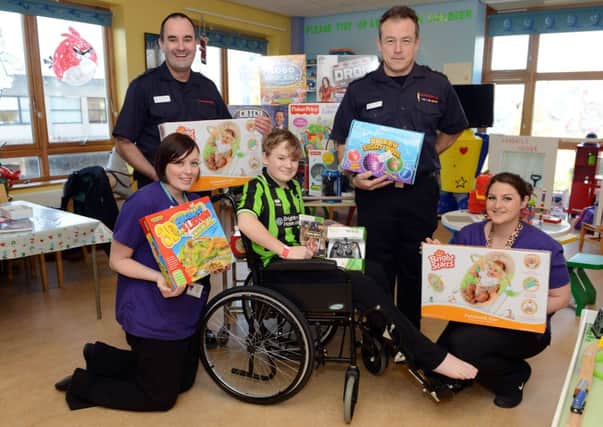 W52070H13 Roy Barraclough and Darren Wickings give gifts to Worthing Hospital's Bluefin ward