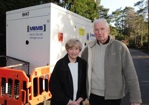 JPCT 201213 Keith and Madeline Hatton are upset that a diesel generator has been placed at the bottom of their garden. Photo by Derek Martin