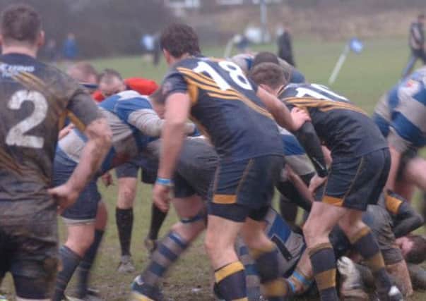 Hastings & Bexhill battle it out with Eastbourne in appalling conditions on Saturday. Picture by Simon Newstead
