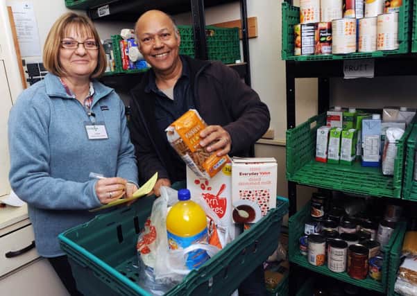 W52945H13   Louise Withington and Larry Surtie at Worthing food bank