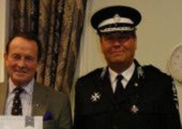 Dr James Walsh, of Rustington, is pictured with his successor as Sussex St John Ambulance County Commander Paul Dedman, who presented him with a long service award for 37 years with the first aid group