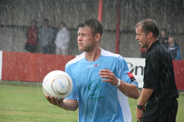 Hastings United's away fixture against Hythe Town back in August was played in heavy rain. Picture by Terry S. Blackman