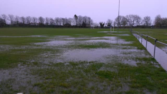 A waterlogged pitch at The Salts, home of Rye United Football Club. Picture by Simon Newstead