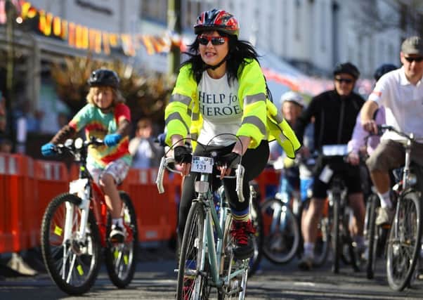 A woman takes part in the Greater Haywards Heath Bike Ride on April 21, 2013 in Haywards Heath, England. Photo by Jordan Mansfield
