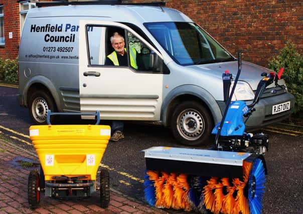 Parish council works officer Dick  Nye with the new council snow  sweeper (right) and gritter, plus the new council vehicle. Pic by Steve Bailey