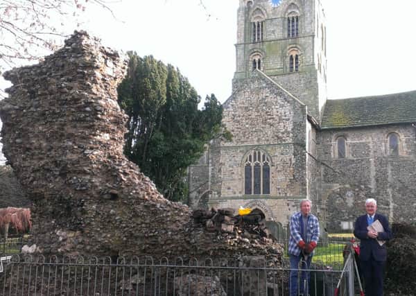 Churchwarden Ian Tompkin, right, and contractor Dave Stringer with the ruin, seen from the west side