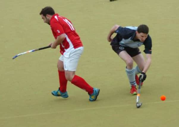 Jamie Busbridge, right, will miss South Saxons Hockey Club's opening game of 2014 through holiday. Picture by Simon Newstead