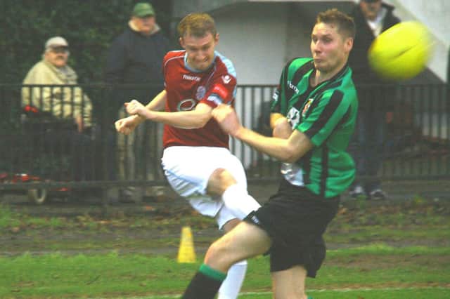 Tom Gilbert delivers a cross during Hastings United's most recent game at home to Burgess Hill Town. Picture by Terry S. Blackman
