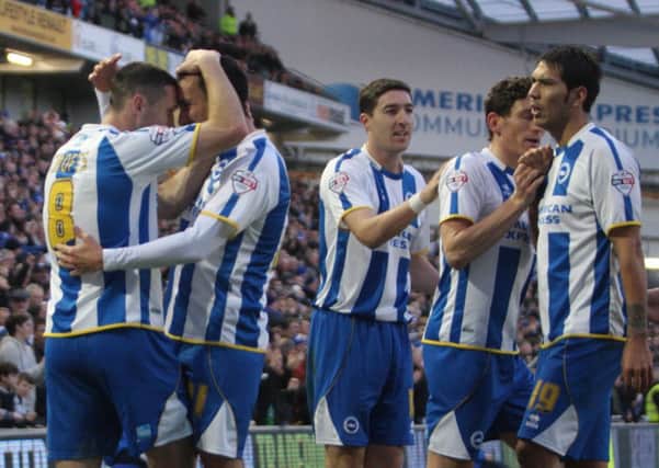 Albion players celebrate with match-winner David Lopez. Pic by Angela Brinkhurst