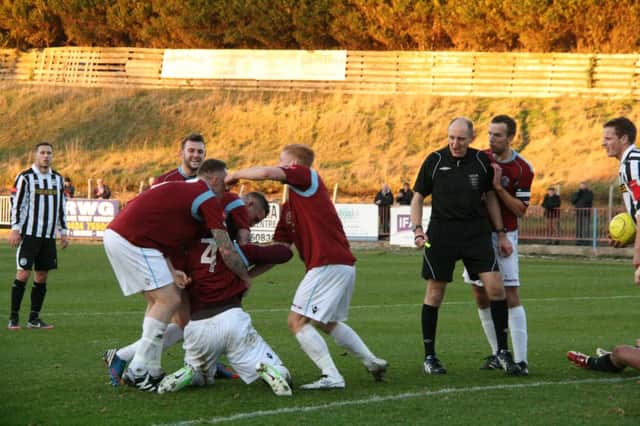 Hastings United celebrate after taking the lead against Peacehaven & Telscombe. Picture by Terry S. Blackman