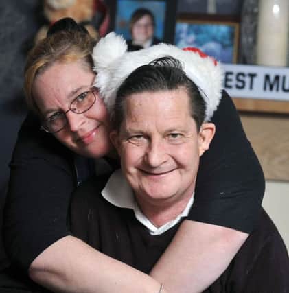 W02081H14-DoubleTransplant

Football Fan, Stephen Knight, who had a double kidney transplant at St George's Hospital in London over Christmas and returned home on New Years Day to celebrate his Christmas.  Pictured with his partner, Janette Denney.  Worthing.