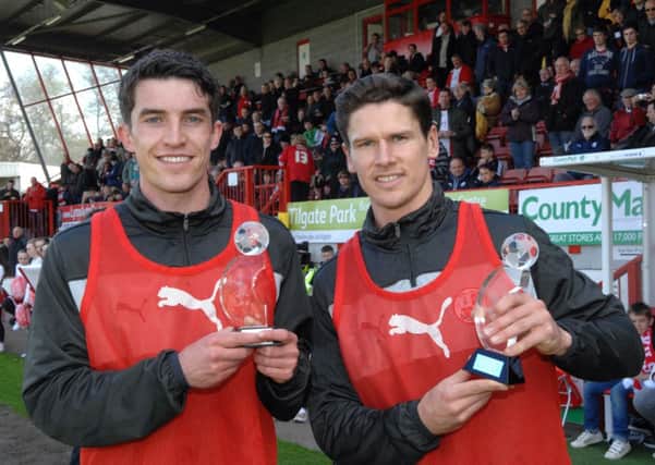 Joe Walsh (left) receiving his Young Player of the Year award last season, alongside captain Josh Simpson