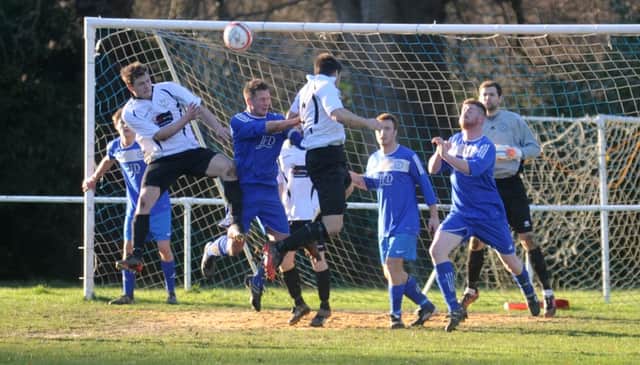 Bexhill United go on the attack during their 2-0 win away to Midhurst & Easebourne last weekend. Picture by Louise Adams (C140060-3)