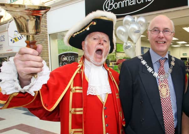130711 Opening of new Bon Marche store in Burgess Hill. L to R town council chairman Chris Thomas-Atkin Town Crier Neil Batsford and Inga Herlihy of WAM  who cut the ribbon . photo derek martin