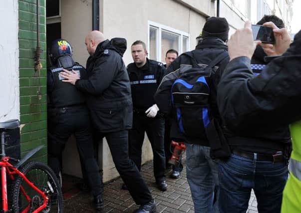 Police start their raid at a flat complex in Norfolk Road, Littlehampton