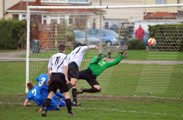 Jamie Salvidge scores Bexhill United's opening goal in the 4-2 win at home to Storrington this afternoon. Picture by Steve Hunnisett (fh03014d)