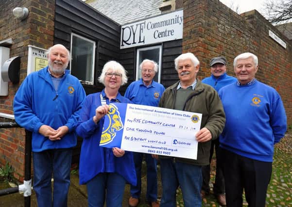 17/1/14- Rye Lions present a cheque to the Rye Community Centre for roof repairs.