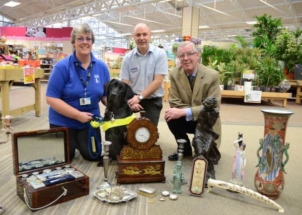 Tracey Clarke, a volunteer for the Worthing Guide Dogs, is pictured with Haskins Roundstone Garden Centre general manager Nick Joad and Anthony Wadey, of Castle Antiques, Bramber