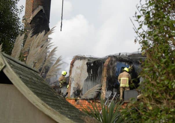 The thatched cottage in East Preston that was wrecked by a blaze, last night. Photo taken from the road, outside the property's grounds