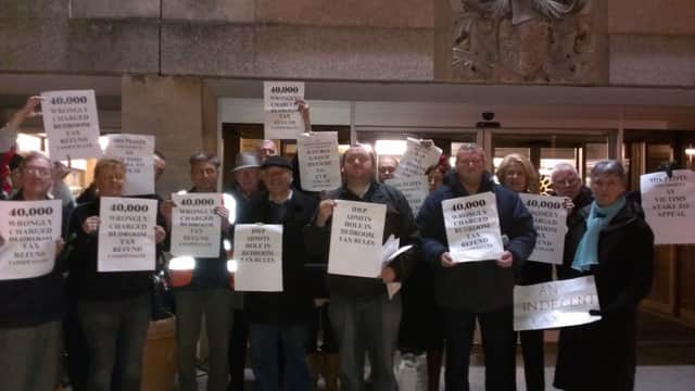 Crawley residents stage a protest outside Crawley Town Hall asking the council to refund bedroom tax wrongly charged to some tenants