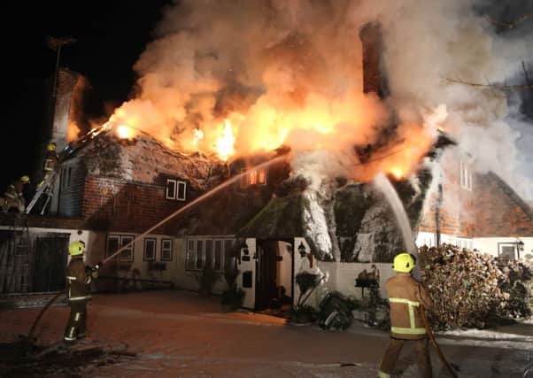 Firefighters battle to contain a blaze at a home in East Preston    PHOTO: Eddie Mitchell