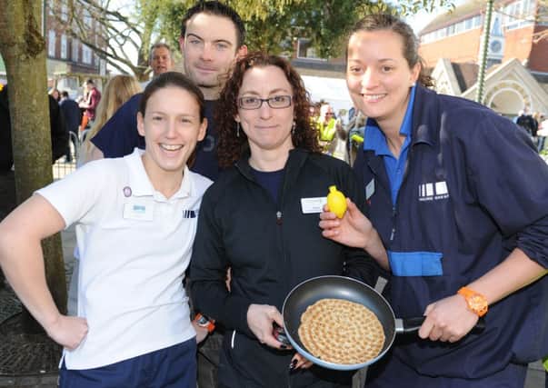 JPCT 190213 S13081444x  Horsham Rotary charity pancake races in the Carfax.  Race winners, BBH Leisure Centre, DC Leisure team -photo by Steve Cobb