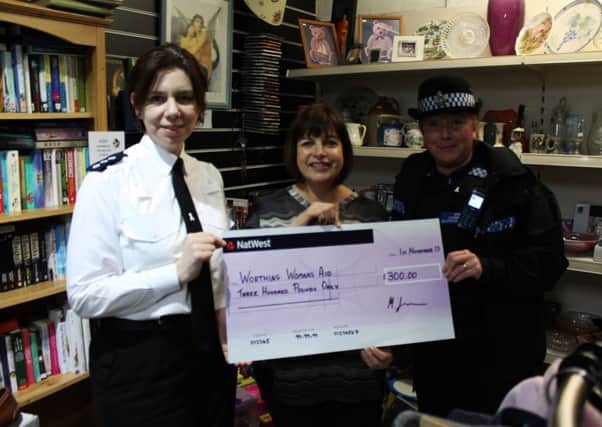 Chief Inspector Jo Banks and PCSO Ann-Marie Rushworth present a cheque