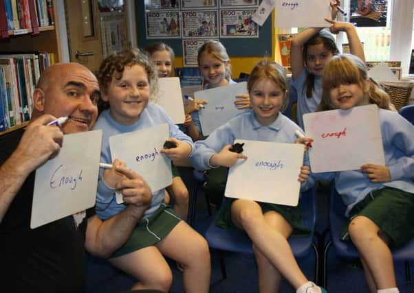 Farlington students with Sir Linkalot teaching them techniques for how to spell enough