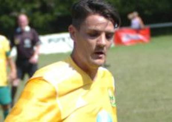 Westfield have accused Eastbourne Town of making an illegal approach for striker Dominic Clarke
