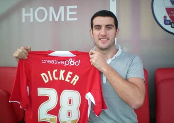 Gary Dicker after signing for Reds until the end of the season. And below playing for Brighton